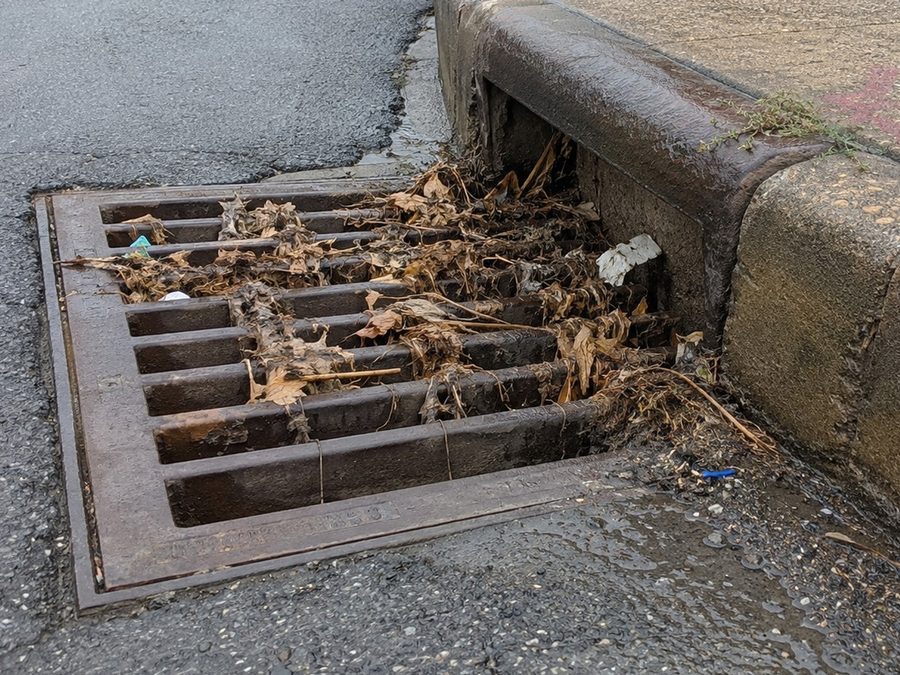 Condition-focused view of a debris-filled storm drain recorded with a fragility-index ranking of 3.
